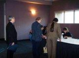 photo: Meeting participants at the registration table