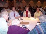 photo: Meeting participants discuss issues as Working Group member Christine Wright listens