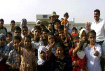 CPA South-Central Regional Coordinator Mike Gfoeller opens Liberation School with Iraqi children