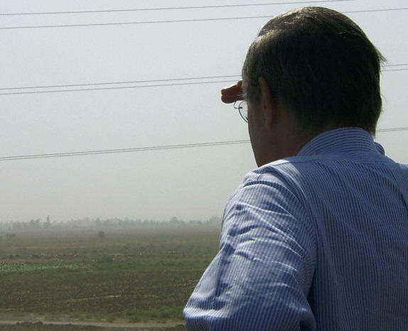 U.S. Defense Secretary Donald Rumsfeld looks at a Mass Grave site in Al-Hilla