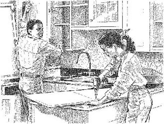 A man and a women remodeling a kitchen